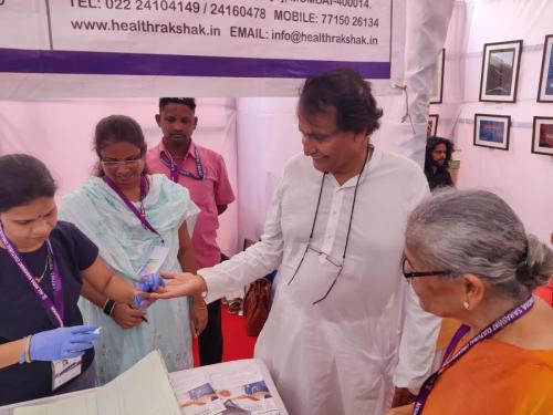 Mr. Suresh Prabhu getting himself checked at the medical camp